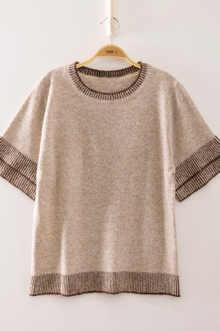 Oatmeal short sleeve knit top with dark contrast ribbed neckline cuffs and hem