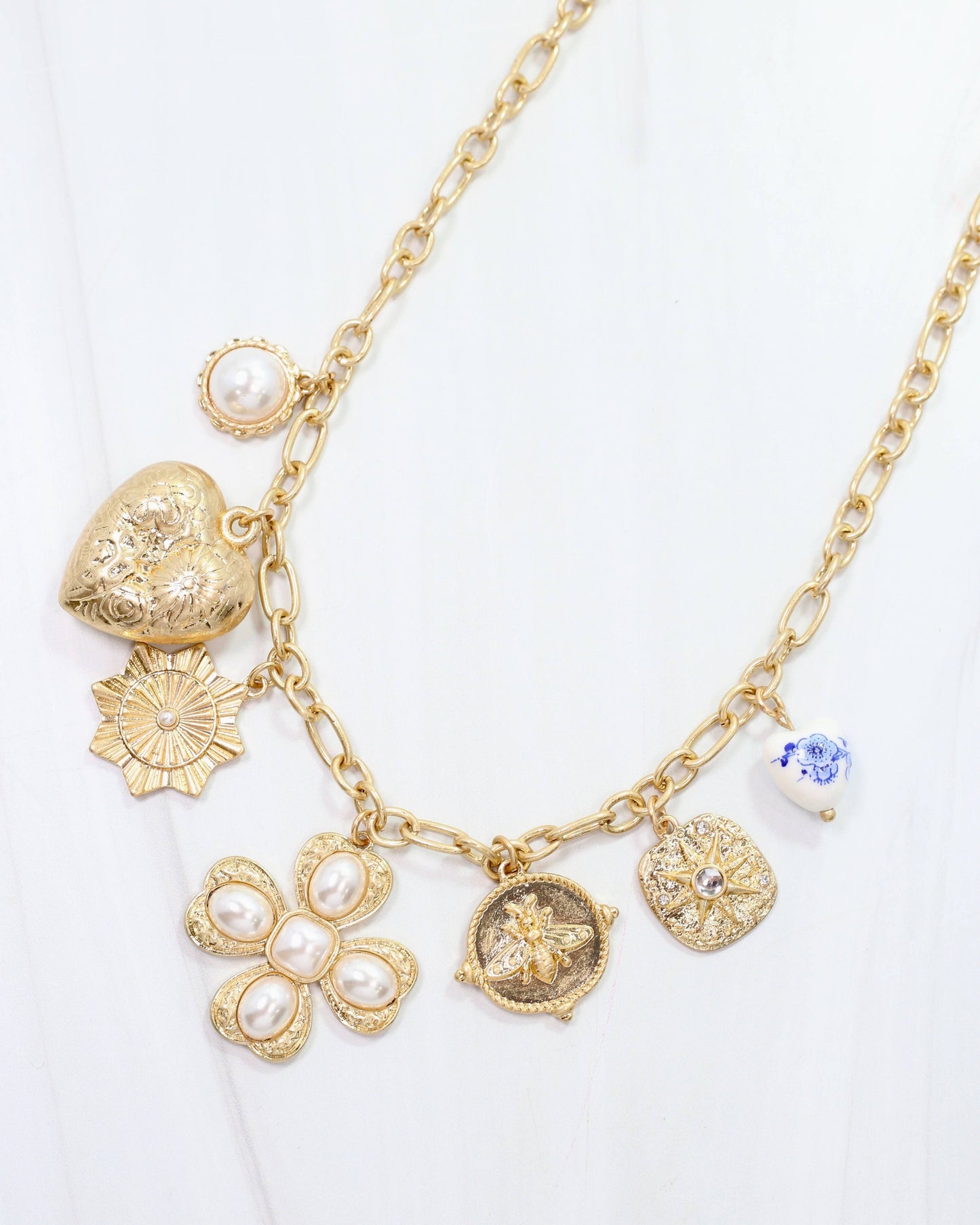 Verona Gold and Pearl Charm Necklace Worn Gold