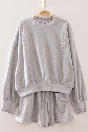 Gray lace trim sweatshirt and matching drawstring shorts lounge set on a hanger